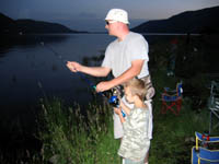 Michael reeling in his first fish